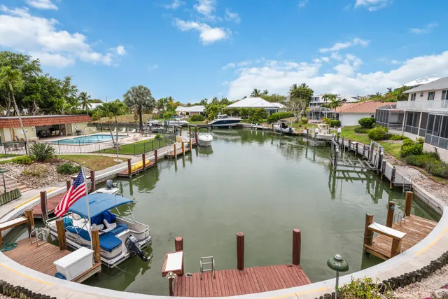 a view of a lake with a table and chairs