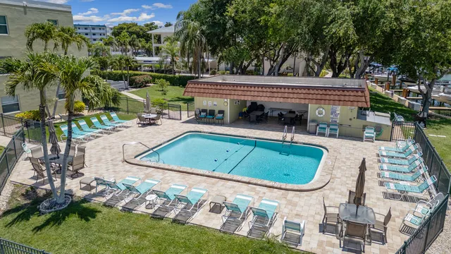 a sign that is in front of flowers