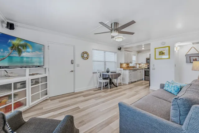 a front view of a building with tree s