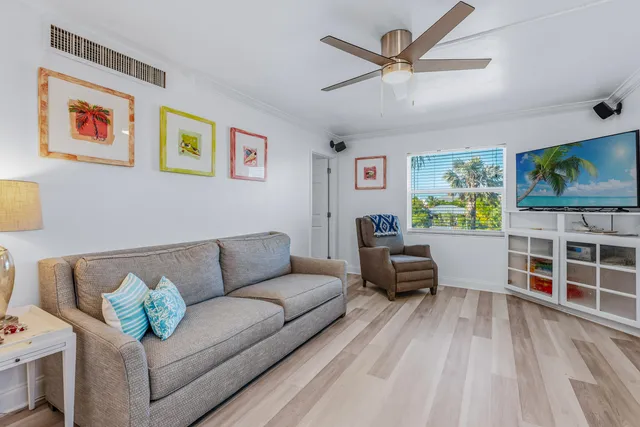 a kitchen with stainless steel appliances granite countertop a refrigerator sink and stove