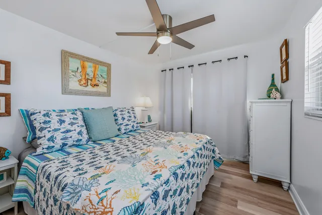 a bedroom with double bed and a window