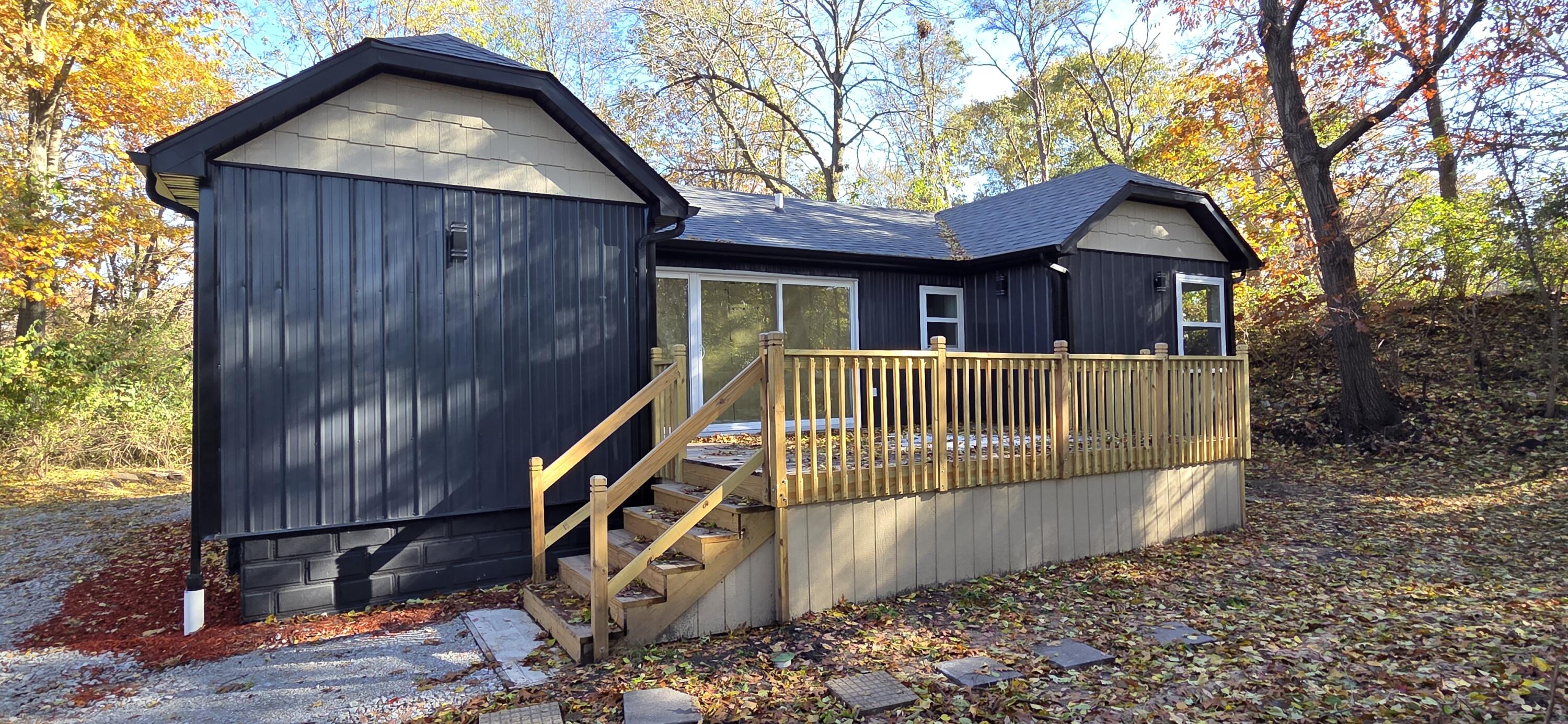 7325 Locust Avenue Gary, IN 46403 - Photo 116 of 136 a view of wooden house with a yard and large trees