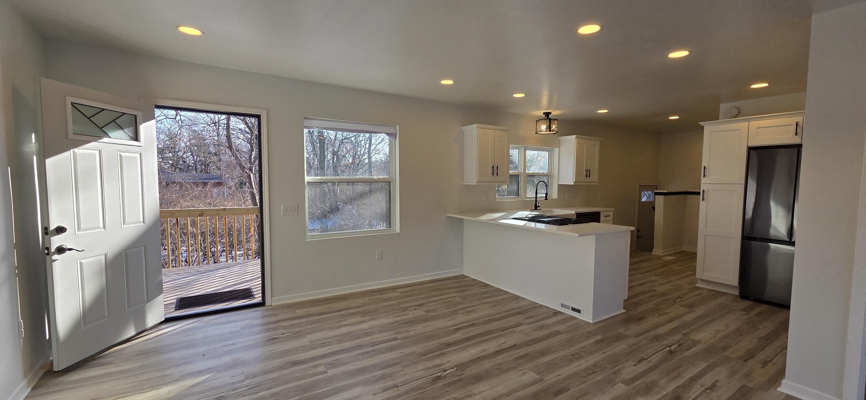 7325 Locust Avenue Gary, IN 46403 - Photo 18 of 136 a kitchen with a refrigerator and a stove top oven