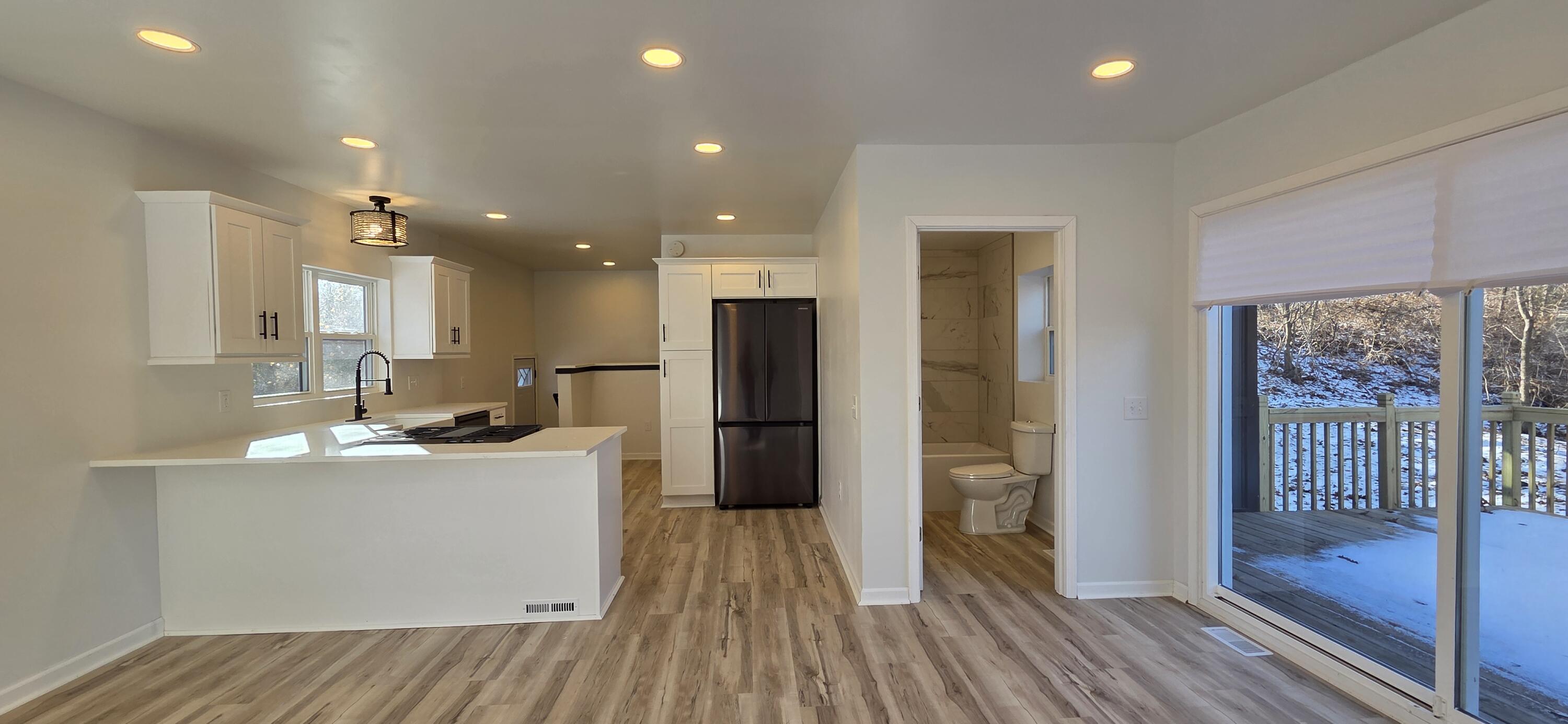 7325 Locust Avenue Gary, IN 46403 - Photo 19 of 136 a kitchen with stainless steel appliances a refrigerator sink and cabinets