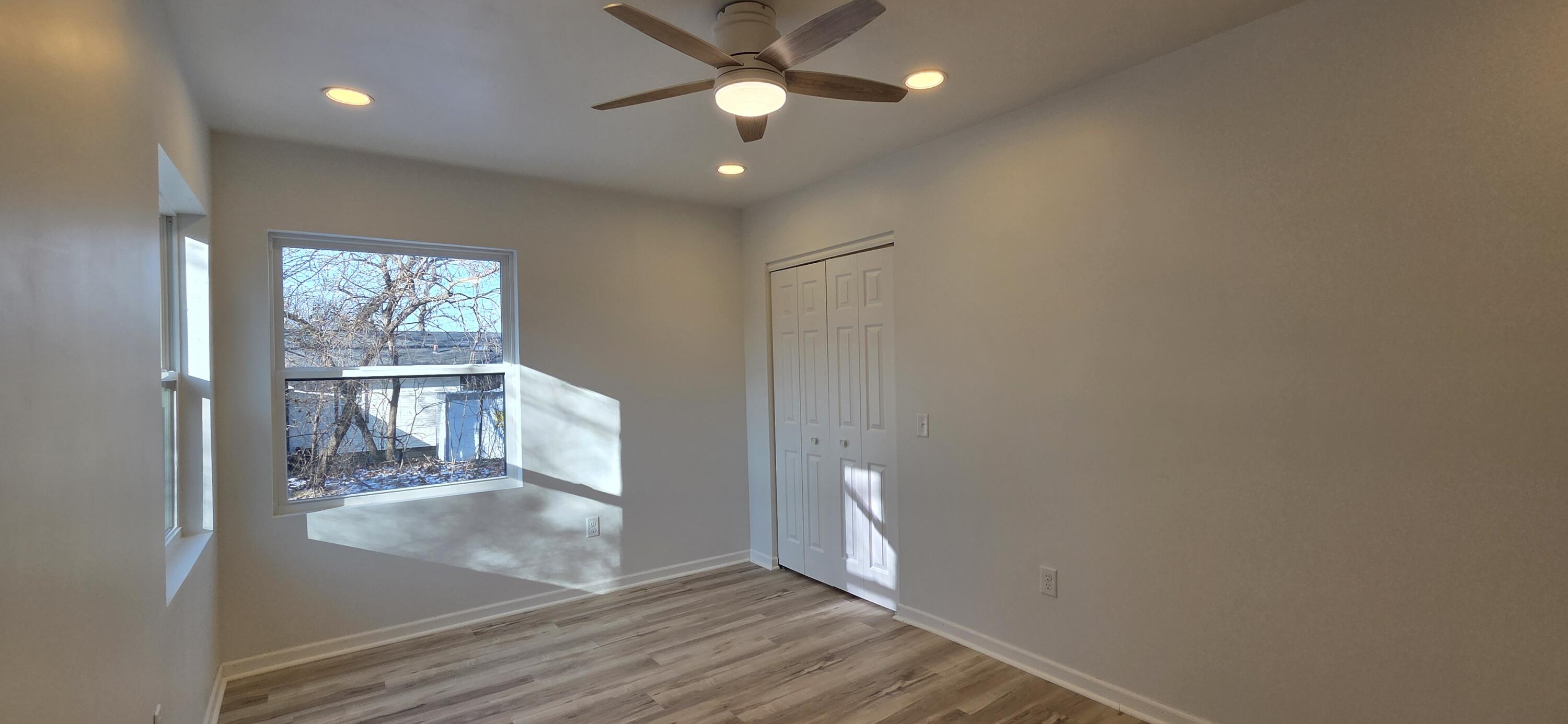 7325 Locust Avenue Gary, IN 46403 - Photo 33 of 136 a view of a hallway with wooden floor and a cabinet
