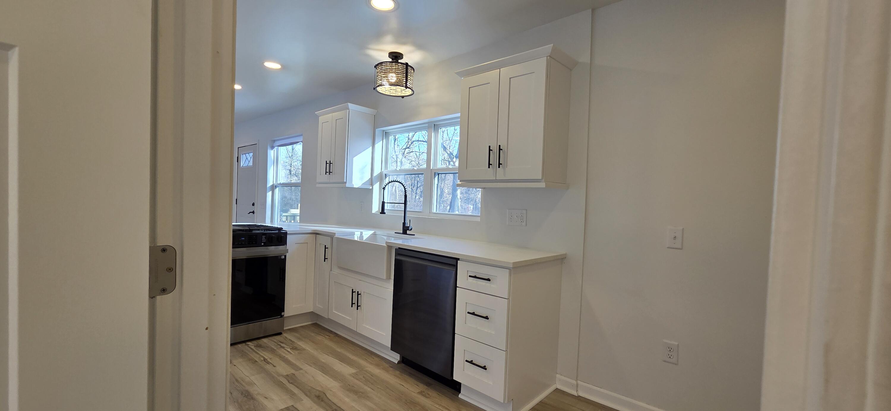 7325 Locust Avenue Gary, IN 46403 - Photo 36 of 136 a spacious bathroom with a double vanity sink and a mirror