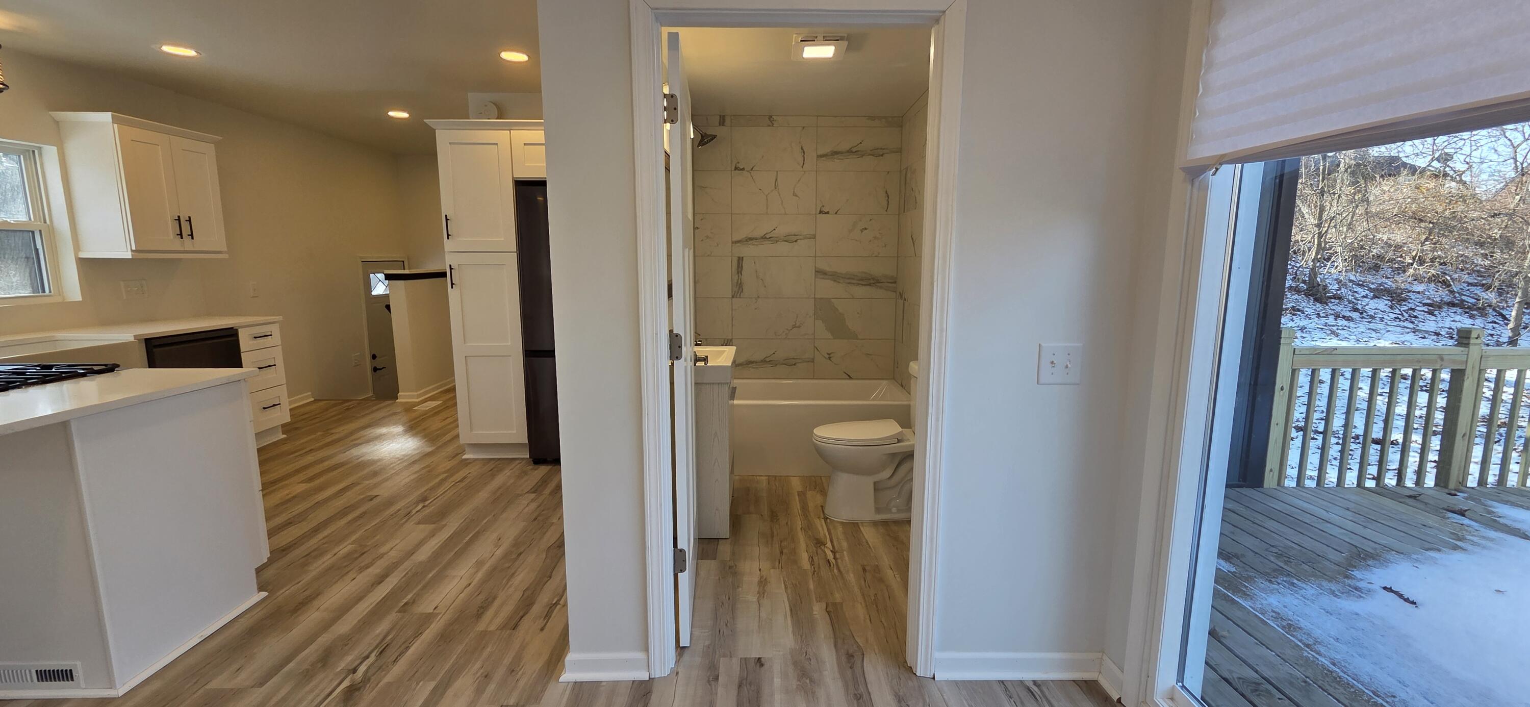 7325 Locust Avenue Gary, IN 46403 - Photo 38 of 136 a bathroom with a glass door shower a sink and a mirror