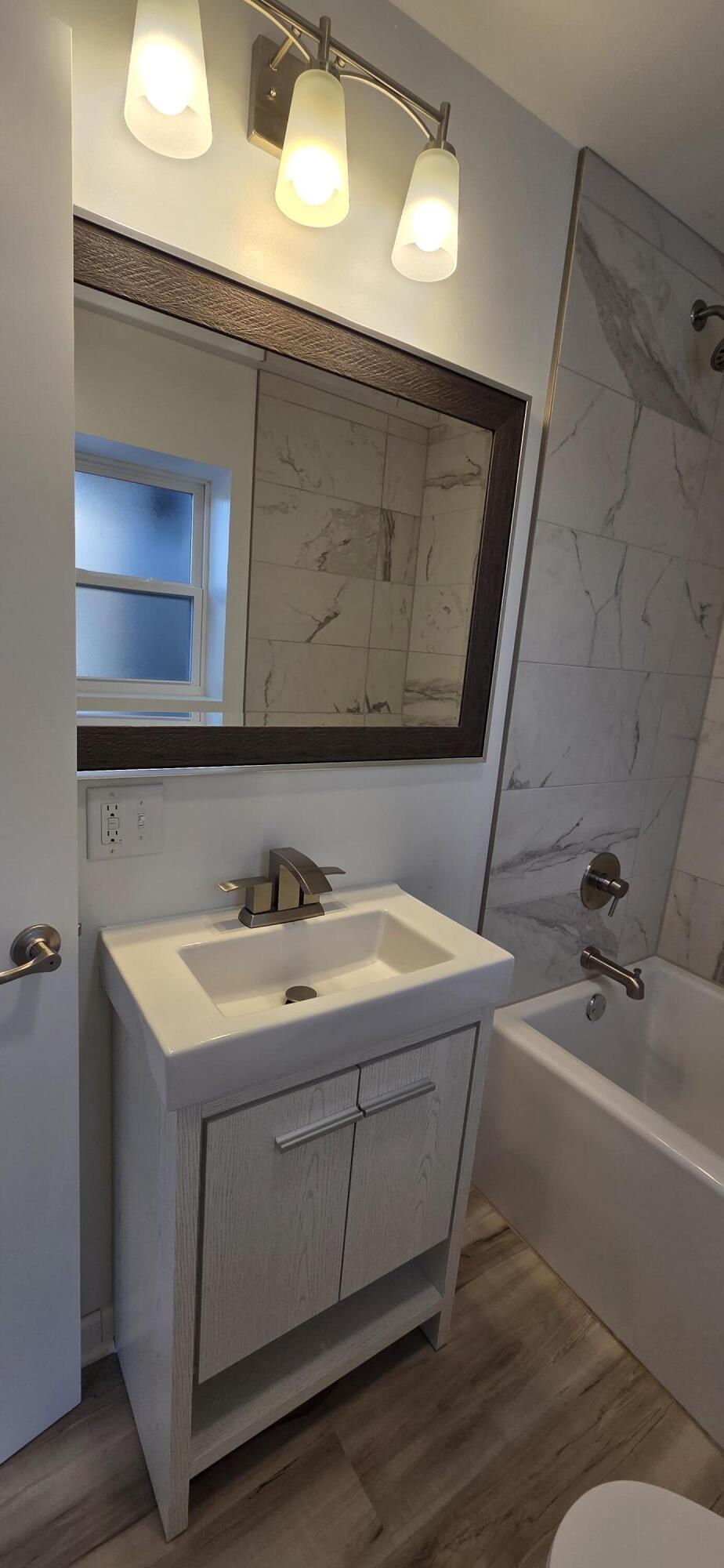 7325 Locust Avenue Gary, IN 46403 - Photo 41 of 136 a bathroom with a sink and a mirror