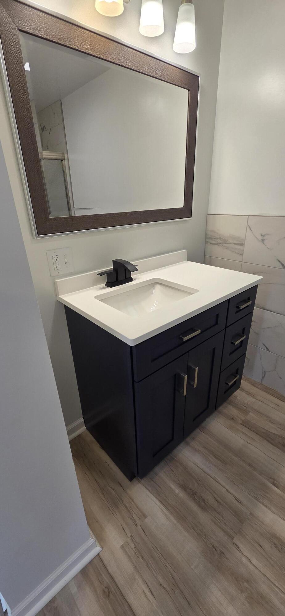 7325 Locust Avenue Gary, IN 46403 - Photo 59 of 136 a bathroom with a sink vanity and a mirror