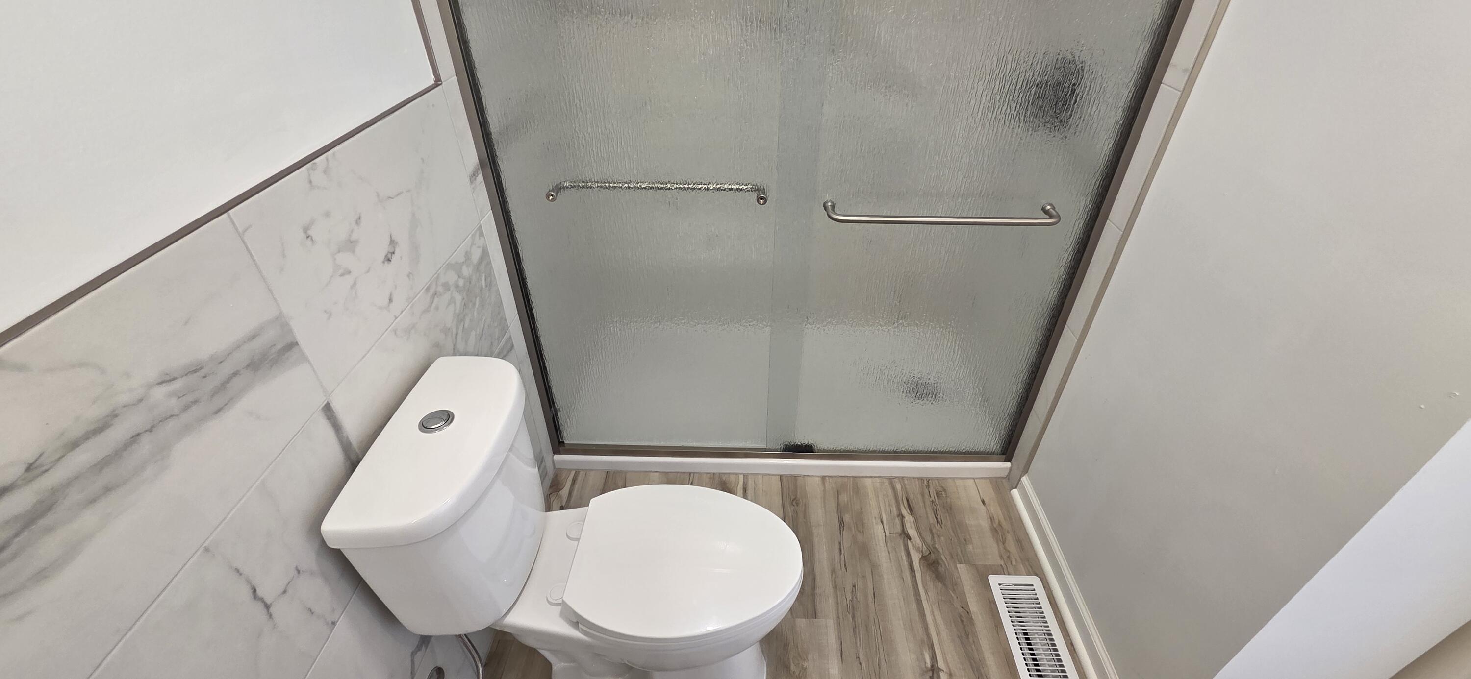 7325 Locust Avenue Gary, IN 46403 - Photo 61 of 136 a bathroom with a toilet and a window