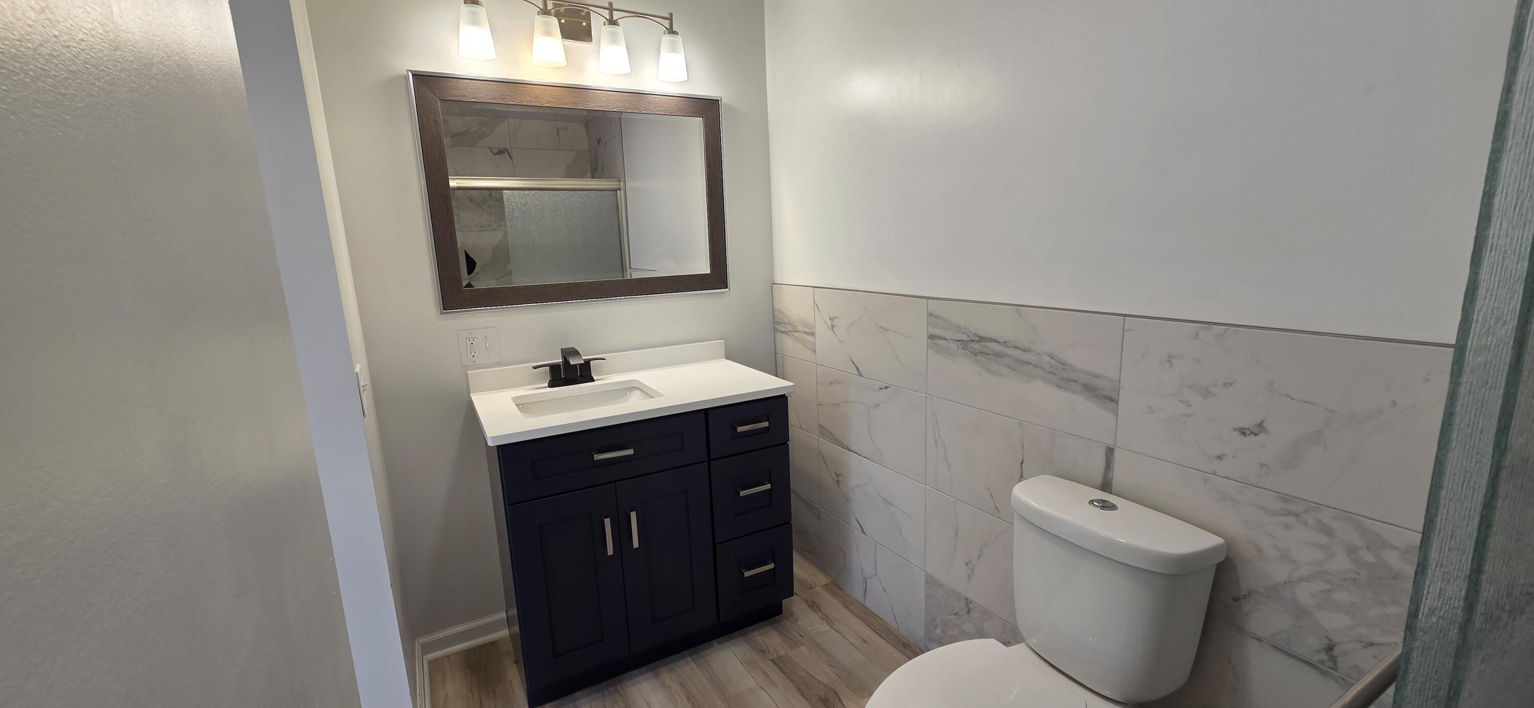 7325 Locust Avenue Gary, IN 46403 - Photo 69 of 136 a bathroom with a toilet sink and mirror