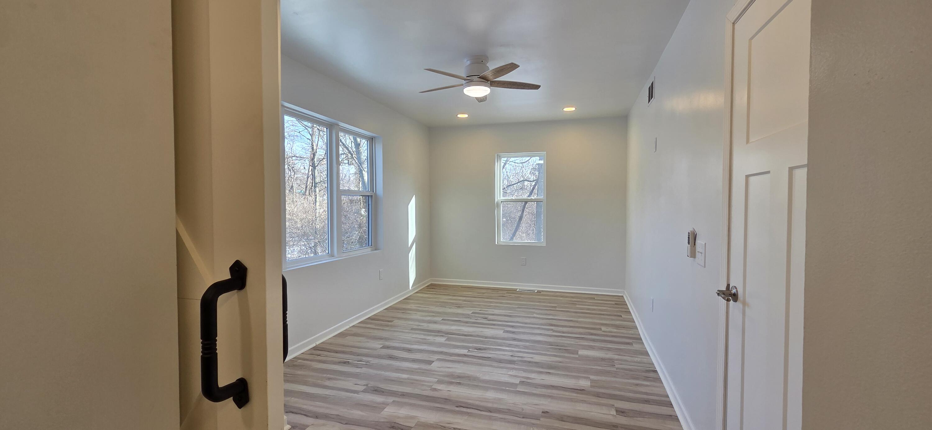 7325 Locust Avenue Gary, IN 46403 - Photo 72 of 136 a view of a hallway with wooden floor and a window