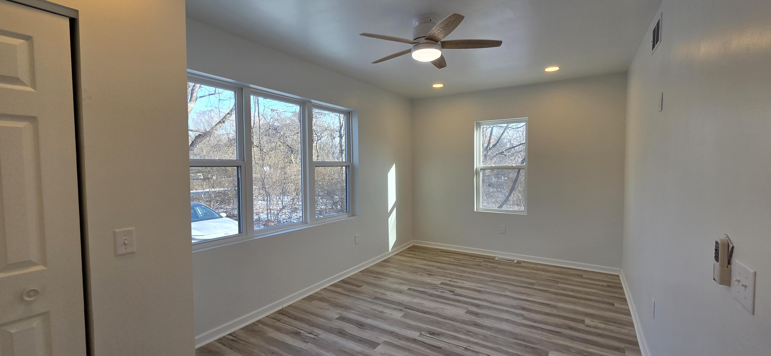 7325 Locust Avenue Gary, IN 46403 - Photo 73 of 136 a view of empty room with wooden floor and fan