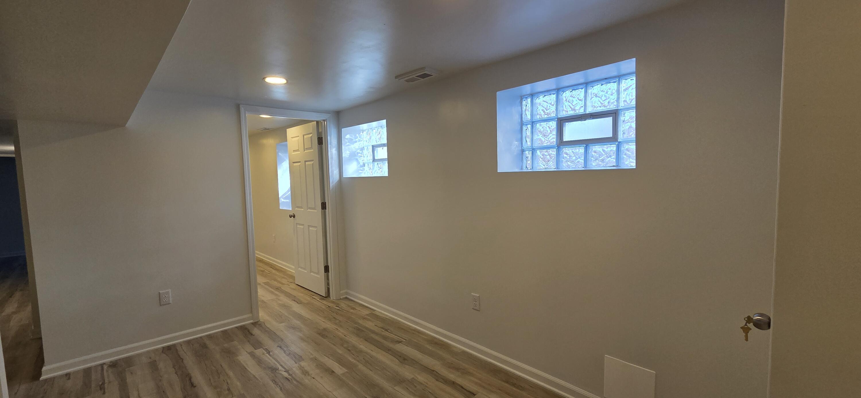 7325 Locust Avenue Gary, IN 46403 - Photo 81 of 136 an empty room with wooden floor and windows