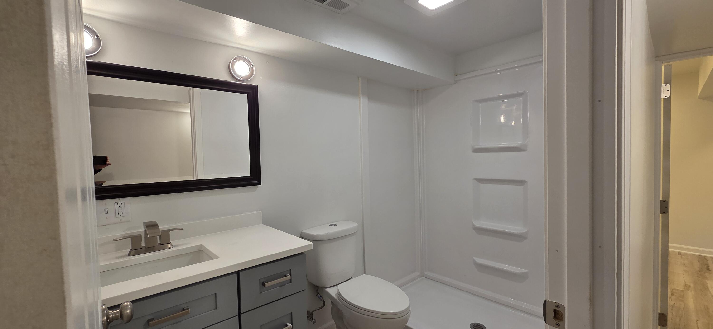 7325 Locust Avenue Gary, IN 46403 - Photo 94 of 136 a bathroom with a toilet sink vanity and mirror