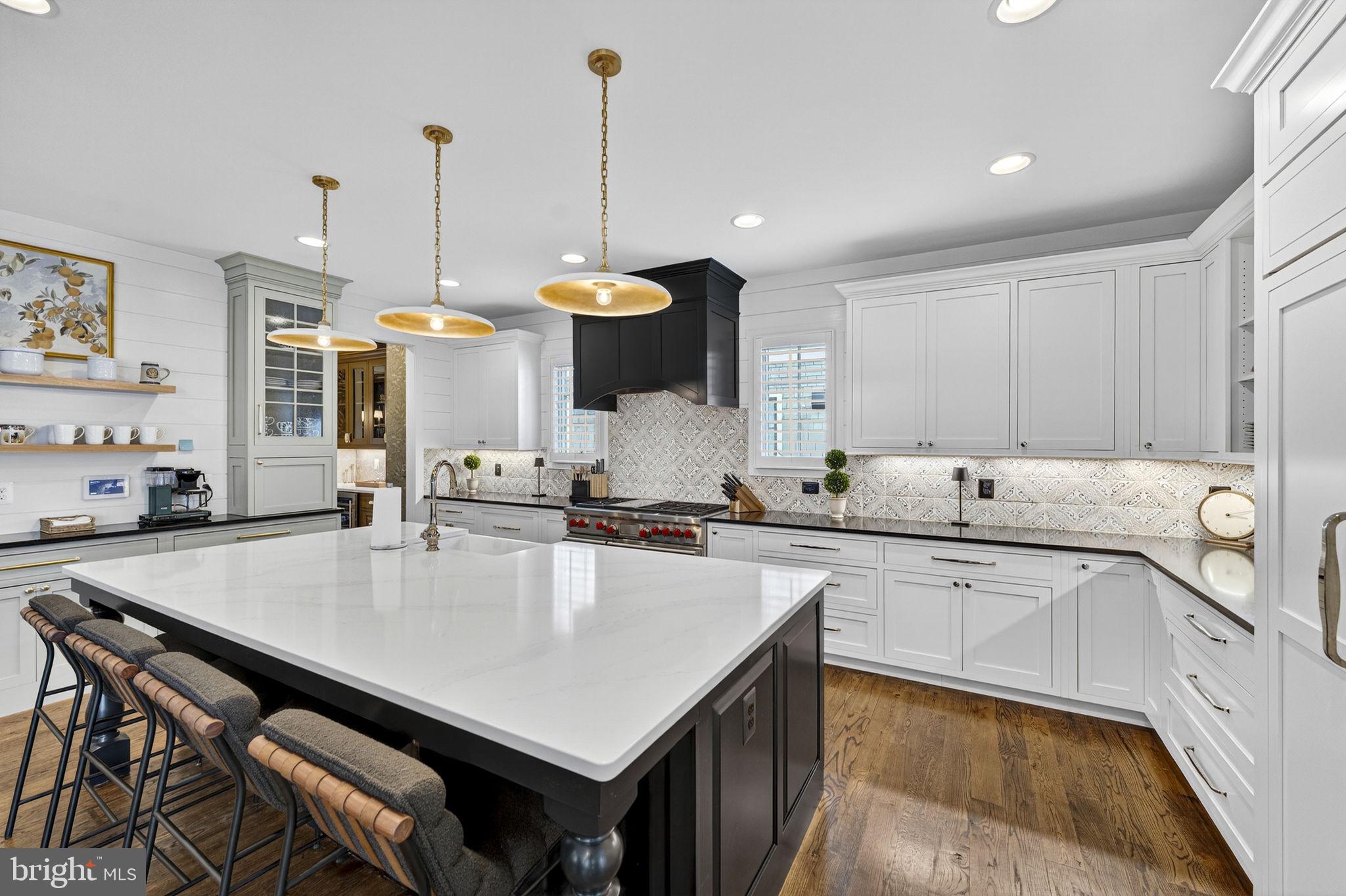 105 Reed Street Middleburg, VA 20117 - Photo 20 of 62 a kitchen with stainless steel appliances granite countertop a sink a stove and chairs