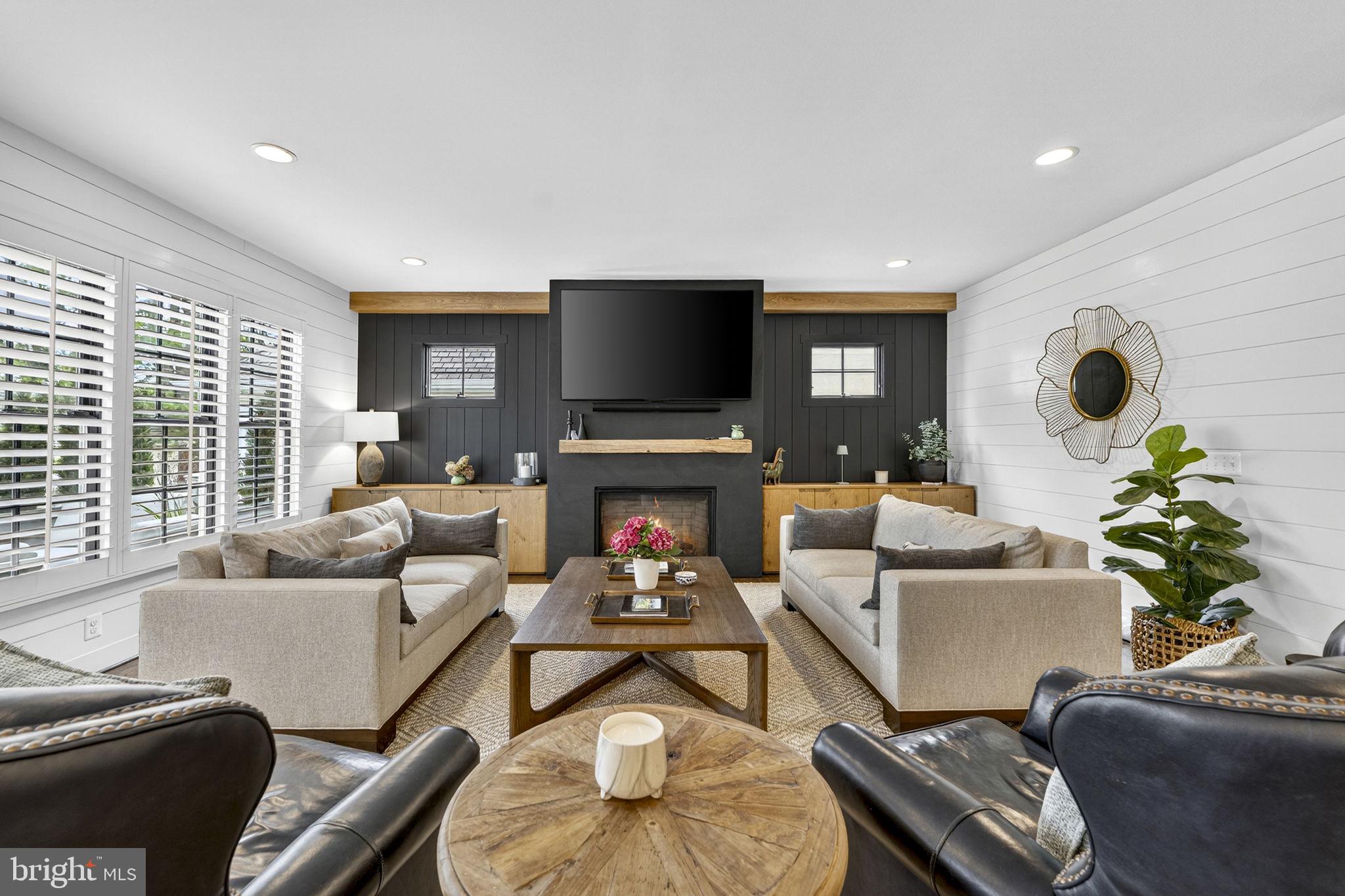 105 Reed Street Middleburg, VA 20117 - Photo 27 of 62 a living room with furniture a fireplace and a flat screen tv