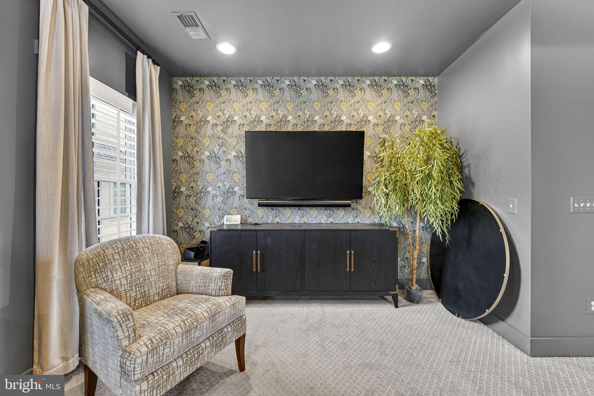 105 Reed Street Middleburg, VA 20117 - Photo 36 of 62 a living room with furniture and a flat screen tv