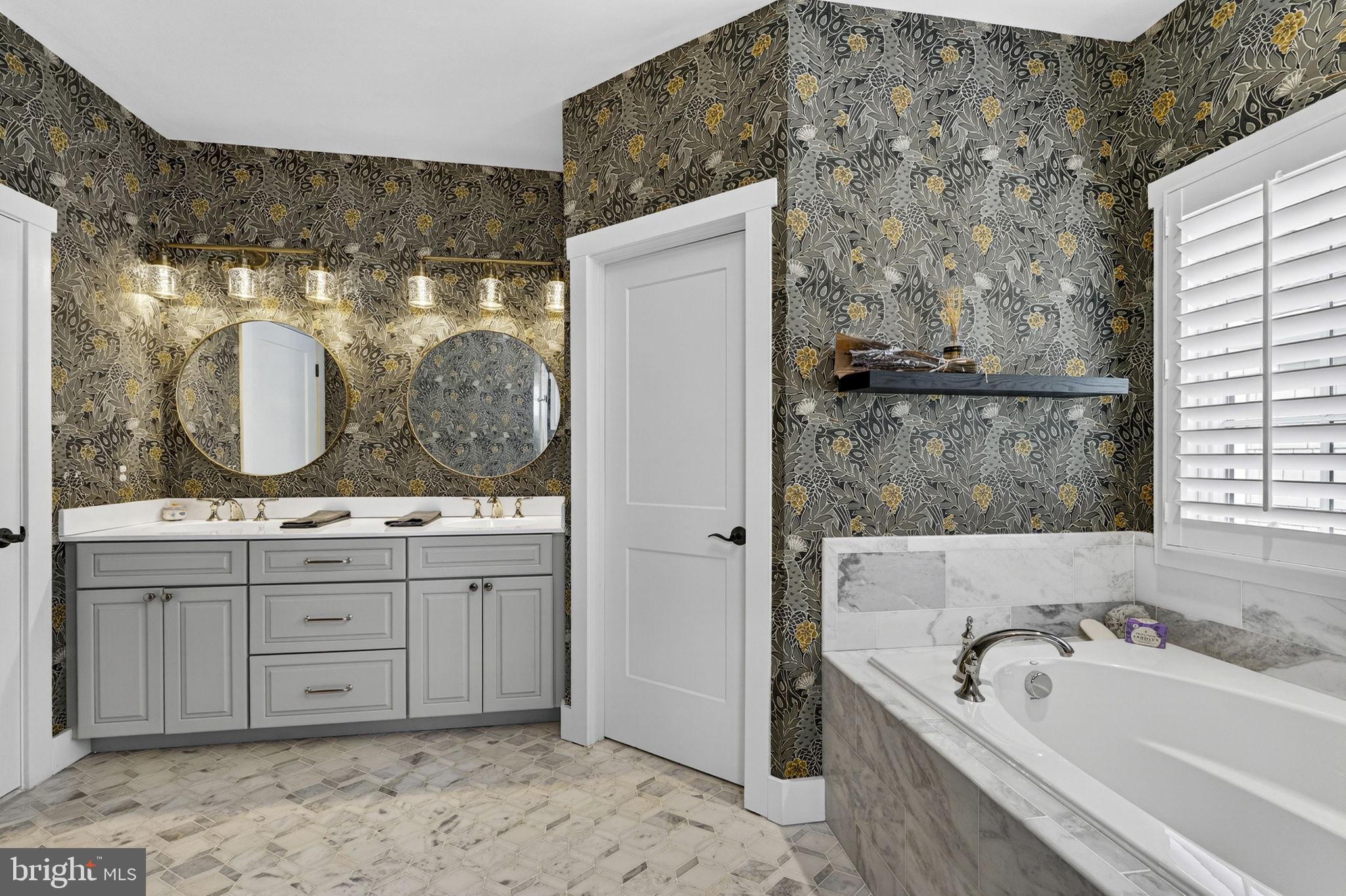 105 Reed Street Middleburg, VA 20117 - Photo 41 of 62 a bathroom with a granite countertop tub sink and mirror