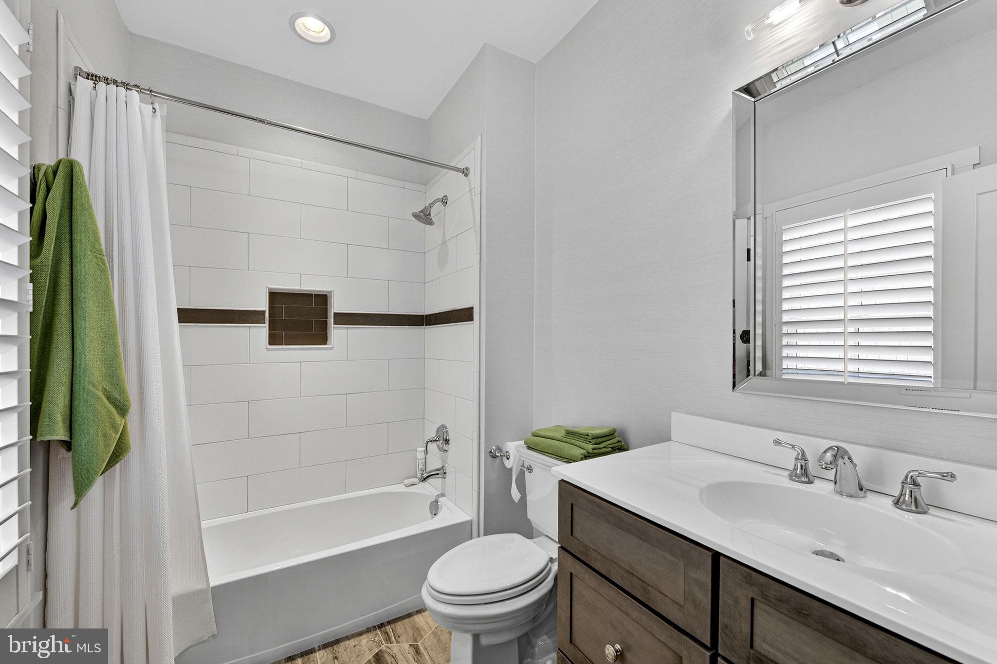 105 Reed Street Middleburg, VA 20117 - Photo 46 of 62 a bathroom with a sink a toilet and a bathtub