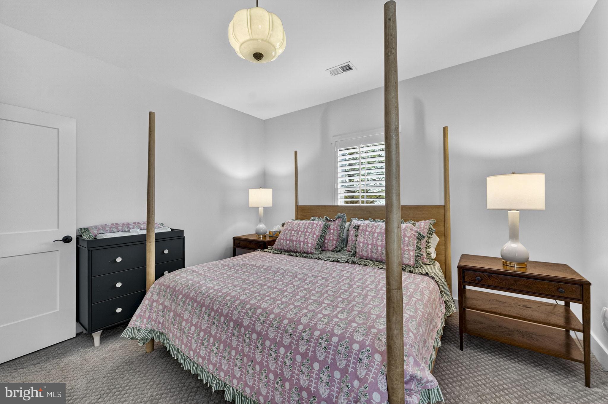 105 Reed Street Middleburg, VA 20117 - Photo 47 of 62 a bedroom with a bed and lamp on the dresser