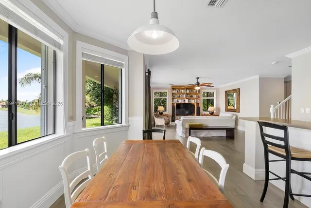 a bathroom with a granite countertop sink toilet and mirror