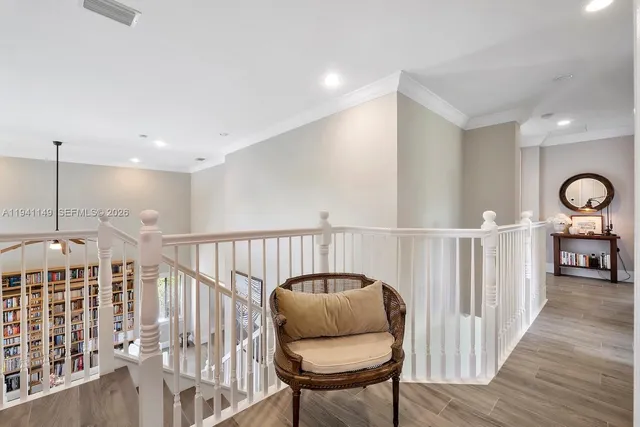 a living room with a couch and a chandelier