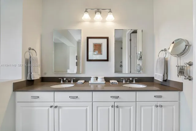a living room with furniture and a dining table with wooden floor
