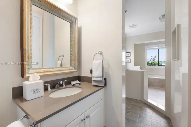 a living room with furniture a rug and a book shelf