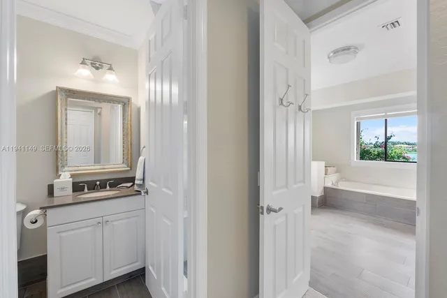 a front view of a house with a yard and fountain