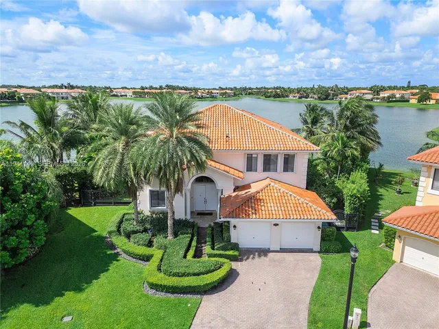 a view of a swimming pool with lounge chairs