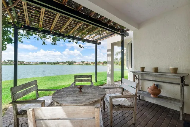 a front view of house with a garden and swimming pool