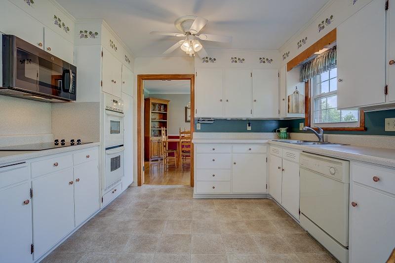 627 Olney Road Vinton, VA 24179 - Photo 13 of 43 a kitchen with granite countertop a stove oven and a sink