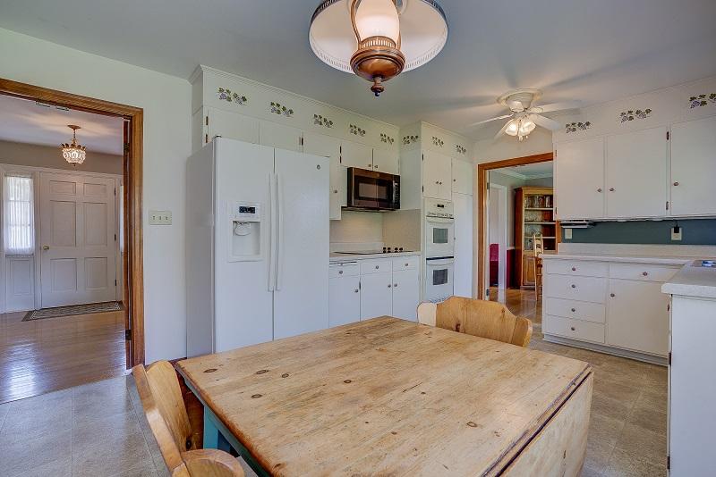 627 Olney Road Vinton, VA 24179 - Photo 16 of 43 a kitchen with stainless steel appliances kitchen island granite countertop a stove a sink and a refrigerator