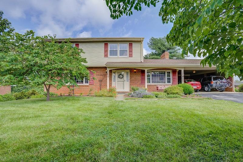 627 Olney Road Vinton, VA 24179 - Photo 3 of 43 a front view of a house with a garden