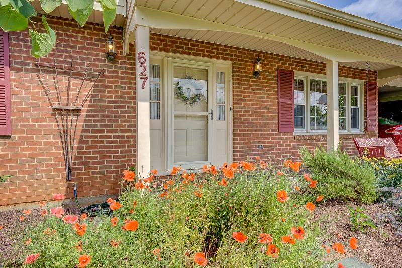 627 Olney Road Vinton, VA 24179 - Photo 4 of 43 a potted plant sitting in front of a house