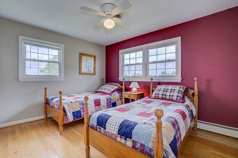 627 Olney Road Vinton, VA 24179 - Photo 32 of 43 a bedroom with two beds and a window