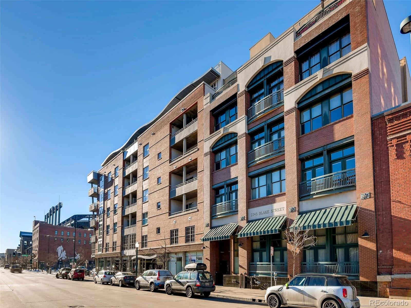 2229 Blake Street, Unit 506 Denver, CO 80205 - Photo 1 of 29 a front view of an apartment building with a street