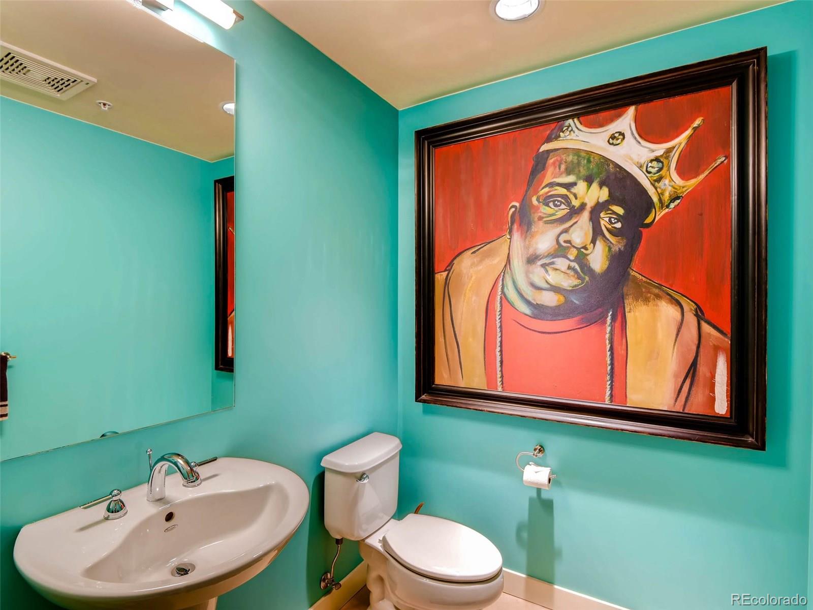 2229 Blake Street, Unit 506 Denver, CO 80205 - Photo 16 of 29 a bathroom with a toilet sink and mirror