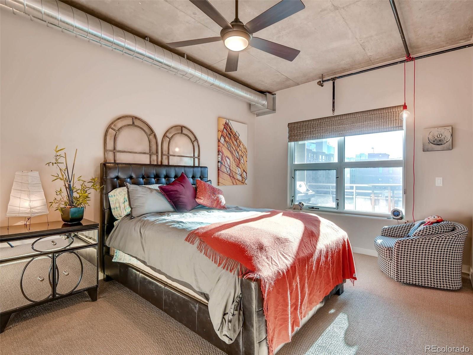 2229 Blake Street, Unit 506 Denver, CO 80205 - Photo 17 of 29 a bedroom with bed and a window