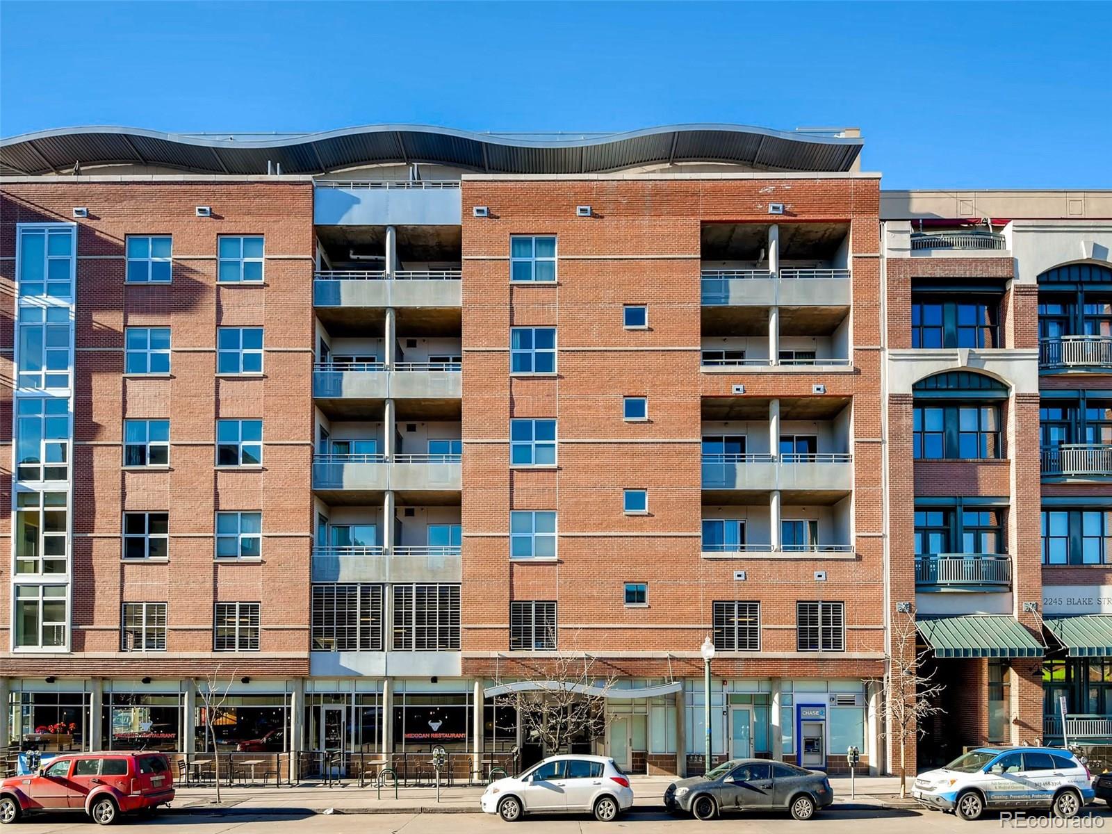 2229 Blake Street, Unit 506 Denver, CO 80205 - Photo 2 of 29 a front view of a building with glass windows