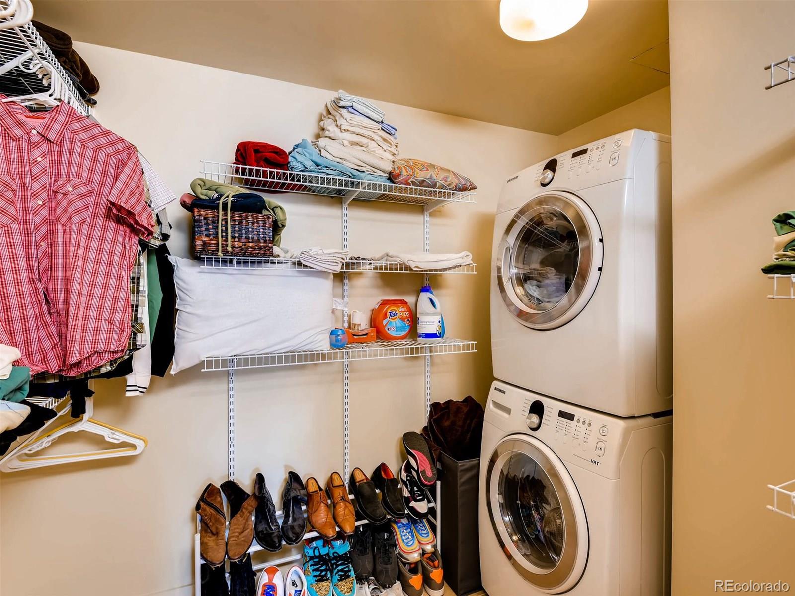 2229 Blake Street, Unit 506 Denver, CO 80205 - Photo 23 of 29 a view of storage and utility room with washer and dryer