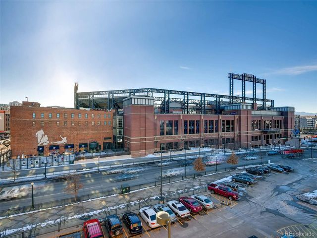 a large building with a table and chairs
