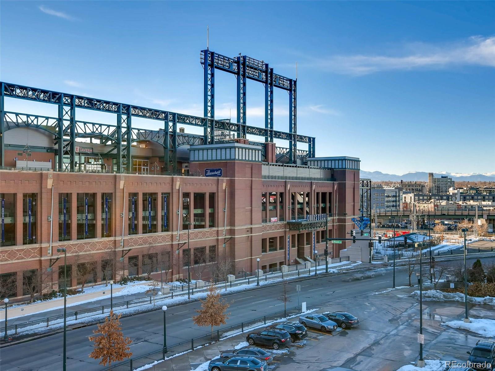 2229 Blake Street, Unit 506 Denver, CO 80205 - Photo 28 of 29 a large building with a table and chairs