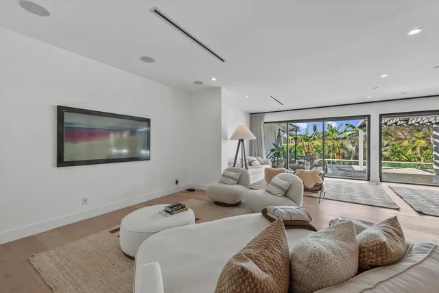 a room with furniture and a floor to ceiling window