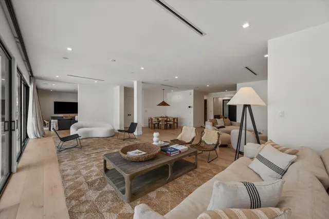 a kitchen with stainless steel appliances granite countertop a sink and a refrigerator