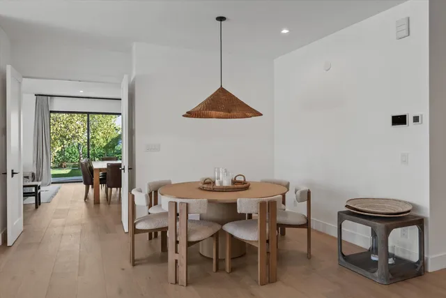 a view of a room that has a bed and a window