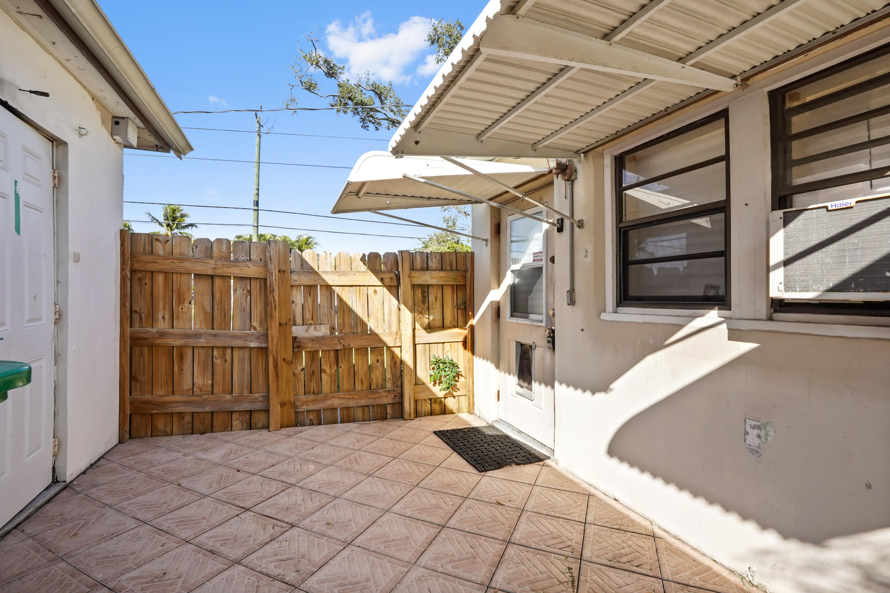 3858 Lakewood Road Palm Springs, FL 33461 - Photo 17 of 39 a view of a house with large trees