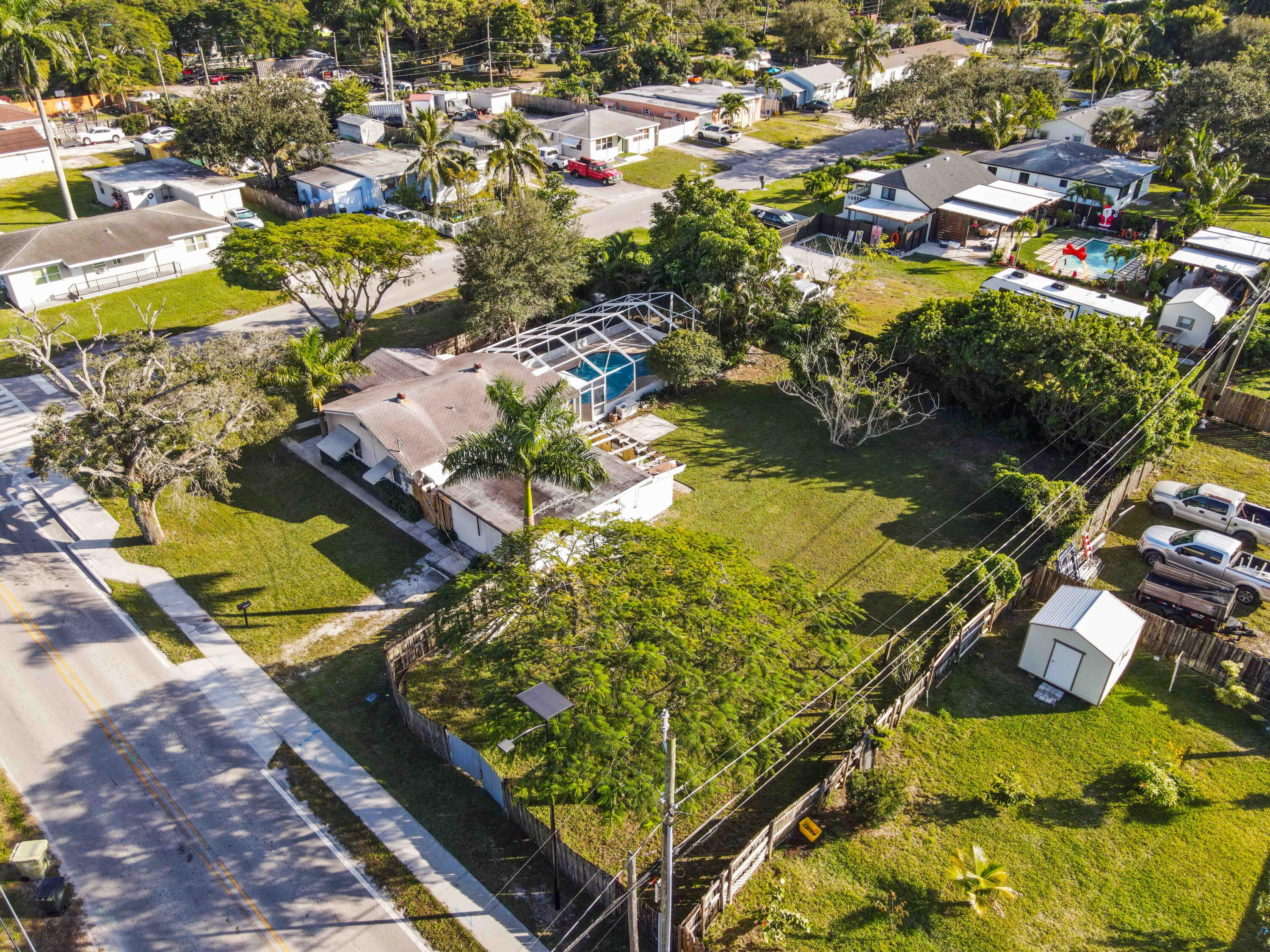 3858 Lakewood Road Palm Springs, FL 33461 - Photo 35 of 39 an aerial view of residential houses with outdoor space