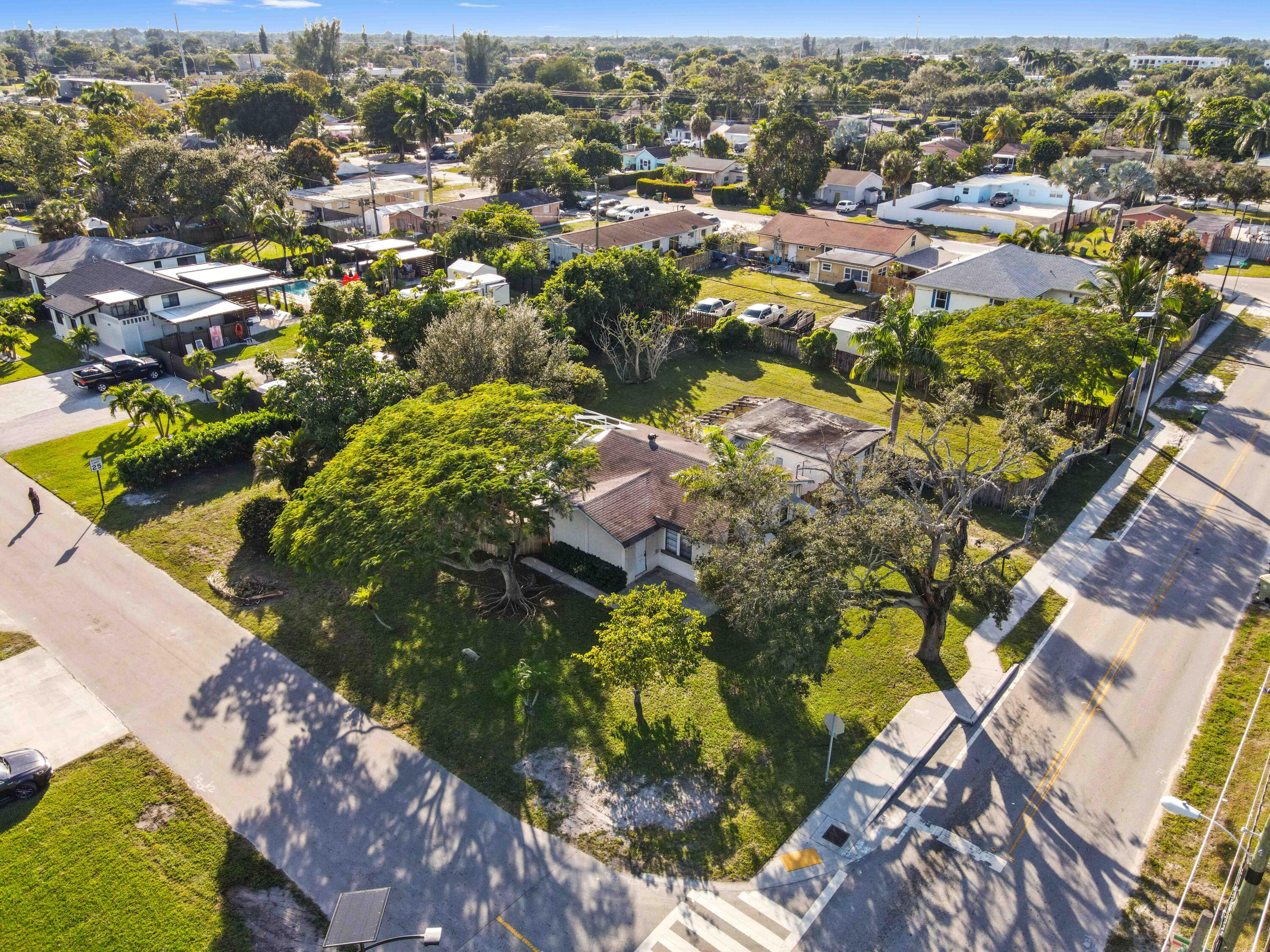 3858 Lakewood Road Palm Springs, FL 33461 - Photo 36 of 39 an aerial view of residential houses with outdoor space